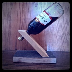Wine bottle balancer with base